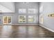 Spacious living room with ample natural light and wood-look flooring at 3025 E Fremont Rd, Phoenix, AZ 85042