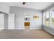 Primary bedroom featuring ceiling fan, window with shutters and adjoining bathroom entrance at 3025 E Fremont Rd, Phoenix, AZ 85042