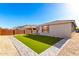 A beautiful backyard featuring artificial grass and modern landscaping at 32611 N 20Th Dr, Phoenix, AZ 85085
