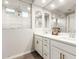 Bright bathroom with a double sink vanity, quartz counters and an enclosed walk-in shower at 32611 N 20Th Dr, Phoenix, AZ 85085