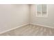 This bedroom has neutral walls and carpet, plus a bright window with white shutter at 32611 N 20Th Dr, Phoenix, AZ 85085