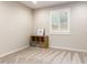 Minimalist bedroom featuring neutral colors and a window with privacy shutters at 32611 N 20Th Dr, Phoenix, AZ 85085