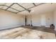 This is a spacious garage with a concrete floor and a new white garage door at 32611 N 20Th Dr, Phoenix, AZ 85085