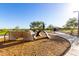 Playground equipment featuring covered platforms and a bridge at 32611 N 20Th Dr, Phoenix, AZ 85085