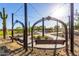 Swing area with metal swings and overhead bistro lights at 32611 N 20Th Dr, Phoenix, AZ 85085