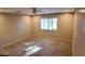 Cozy bedroom with neutral walls, carpet, ceiling fan, and shuttered window at 3323 N 103Rd Ave, Avondale, AZ 85392