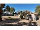 Single-story home featuring a two-car garage, desert landscaping, and a concrete driveway at 3323 N 103Rd Ave, Avondale, AZ 85392