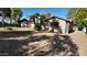 Single-story home featuring desert landscaping, a two-car garage, and a concrete driveway at 3323 N 103Rd Ave, Avondale, AZ 85392