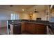 Open kitchen with granite countertops, stainless steel appliances, and wood cabinetry at 3323 N 103Rd Ave, Avondale, AZ 85392