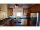 Kitchen features granite countertops, custom cabinets, and stainless steel appliances at 3323 N 103Rd Ave, Avondale, AZ 85392