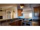 Kitchen featuring custom cabinets, granite countertops, and stainless steel appliances at 3323 N 103Rd Ave, Avondale, AZ 85392