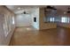 This is a spacious living room with tile flooring, plantation shutters, and ceiling fans at 3323 N 103Rd Ave, Avondale, AZ 85392