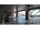 Large covered patio with outdoor dining area and ceiling fan at 3323 N 103Rd Ave, Avondale, AZ 85392