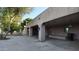 Wide covered patio with pillars, lamps, and access to the backyard at 3323 N 103Rd Ave, Avondale, AZ 85392