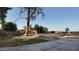 Spacious yard with mature trees, partial fencing, and ample room for outdoor activities at 3323 N 103Rd Ave, Avondale, AZ 85392