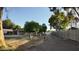 Spacious backyard with mature trees and serene surroundings, ideal for outdoor activities at 3323 N 103Rd Ave, Avondale, AZ 85392