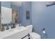 Bathroom featuring a bright mirror, modern vanity, and blue accent wall at 35701 N Bandolier Dr, San Tan Valley, AZ 85144