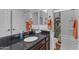 Bright bathroom features granite counters, stylish fixtures, and a shower-tub combo with colorful curtain at 35701 N Bandolier Dr, San Tan Valley, AZ 85144