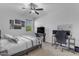 This bedroom is complete with ceiling fan, a work space, and a comfortable queen bed at 35701 N Bandolier Dr, San Tan Valley, AZ 85144