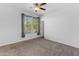 Cozy bedroom with neutral walls, bright windows, and carpeted floors at 35701 N Bandolier Dr, San Tan Valley, AZ 85144