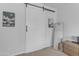 Bedroom featuring a sliding barn door that adds character and style to the modern space at 35701 N Bandolier Dr, San Tan Valley, AZ 85144