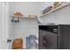 Walk-in closet offering ample storage, shelving, and black storage drawers at 35701 N Bandolier Dr, San Tan Valley, AZ 85144