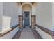 A welcoming entryway featuring a decorative front door and stone pillars at 35701 N Bandolier Dr, San Tan Valley, AZ 85144