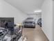 Spacious garage with epoxy flooring, vehicle parking, and workout equipment at 35701 N Bandolier Dr, San Tan Valley, AZ 85144