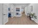 Bright hallway with art, bench, and plant at 35701 N Bandolier Dr, San Tan Valley, AZ 85144