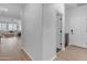 Bright hallway showcasing modern flooring and access to multiple rooms at 35701 N Bandolier Dr, San Tan Valley, AZ 85144