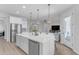 Bright kitchen featuring stainless steel appliances, an island with seating, and an open floor plan at 35701 N Bandolier Dr, San Tan Valley, AZ 85144