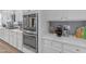 Modern kitchen with stainless steel appliances, including built-in oven and microwave at 35701 N Bandolier Dr, San Tan Valley, AZ 85144