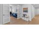 Open living room with hard surface flooring, blue sofa, and stylish décor at 35701 N Bandolier Dr, San Tan Valley, AZ 85144