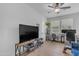 Bonus living room has lots of natural light, vinyl floors, and a ceiling fan at 35701 N Bandolier Dr, San Tan Valley, AZ 85144
