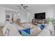 Bright living room showcasing a sectional sofa, stylish decor, and an inviting open layout for seamless entertaining at 35701 N Bandolier Dr, San Tan Valley, AZ 85144