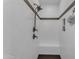 Modern walk-in shower with white tile, a built-in bench, and sleek bronze shower fixtures at 35701 N Bandolier Dr, San Tan Valley, AZ 85144