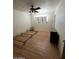 Bedroom features wood flooring, a ceiling fan, and natural light from the covered window at 3701 W Keim Dr, Phoenix, AZ 85019