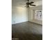 Empty bedroom with tile flooring, ceiling fan, and encased window at 3701 W Keim Dr, Phoenix, AZ 85019