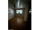 Bedroom with hardwood floors, ceiling fan, and window covered, providing a clean, functional space at 3701 W Keim Dr, Phoenix, AZ 85019