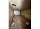 Features a garage with a metal roll-up door and ample space for storage or vehicle parking at 3701 W Keim Dr, Phoenix, AZ 85019