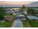 Aerial view of home showcasing landscaping, pool, and proximity to nearby commercial areas at 4036 N 40Th Pl, Phoenix, AZ 85018