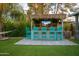 Charming backyard bar featuring an outdoor TV, seating, and delightful thatched roof at 4036 N 40Th Pl, Phoenix, AZ 85018