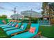 Relaxing backyard featuring loungers, art, a bar and lush landscaping at 4036 N 40Th Pl, Phoenix, AZ 85018