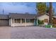 Charming single-story home featuring a well-manicured yard, a stylish brick driveway, and vibrant curb appeal at 4036 N 40Th Pl, Phoenix, AZ 85018