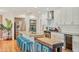 Updated kitchen featuring white cabinets, stainless steel appliances, a marble island, and an attached eating area at 4036 N 40Th Pl, Phoenix, AZ 85018