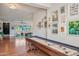 Inviting living area showcasing a vintage shuffleboard table, and eclectic decor at 4036 N 40Th Pl, Phoenix, AZ 85018