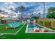 Relaxing backyard with a pool, lounge chairs, and lush landscaping under a beautiful sky at 4036 N 40Th Pl, Phoenix, AZ 85018