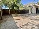Landscaped backyard with trees and patio, providing a serene outdoor living space at 4104 N 113Th Ave, Phoenix, AZ 85037