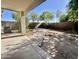 Outdoor space featuring a brick perimeter, mature shade trees, and an open area at 4104 N 113Th Ave, Phoenix, AZ 85037