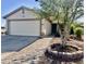 Charming single-story home featuring a two-car garage and a brick-lined walkway at 4104 N 113Th Ave, Phoenix, AZ 85037